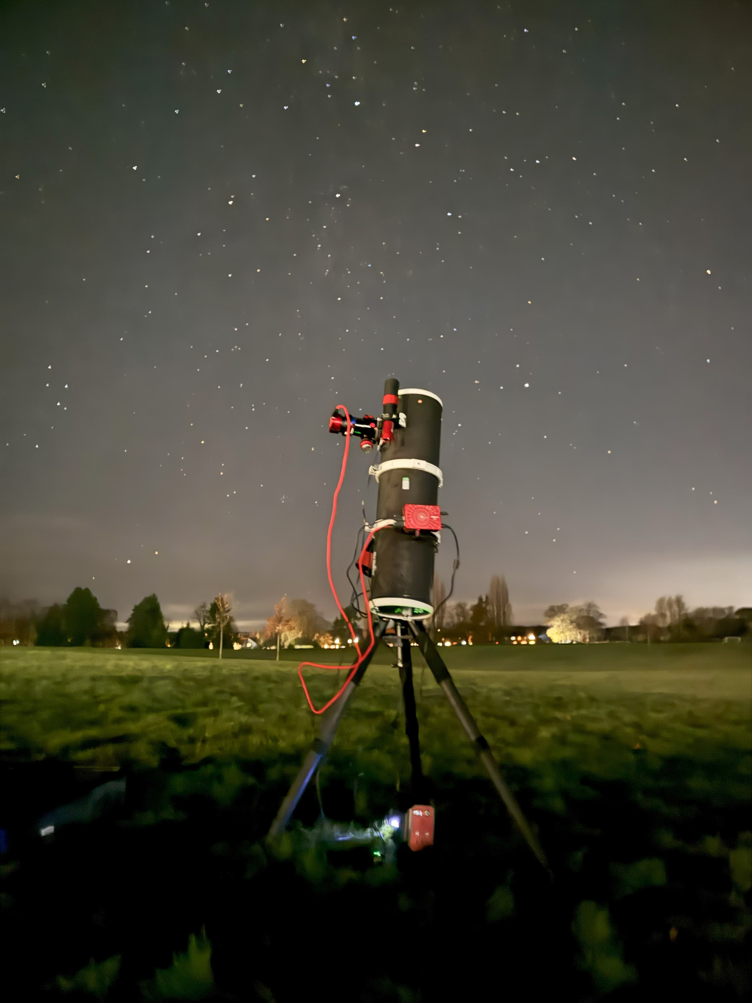 My telescope setup under a starry night sky
